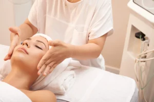 Microneedling with exosomes - woman's face massaged