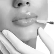 Woman getting lip filler service logo